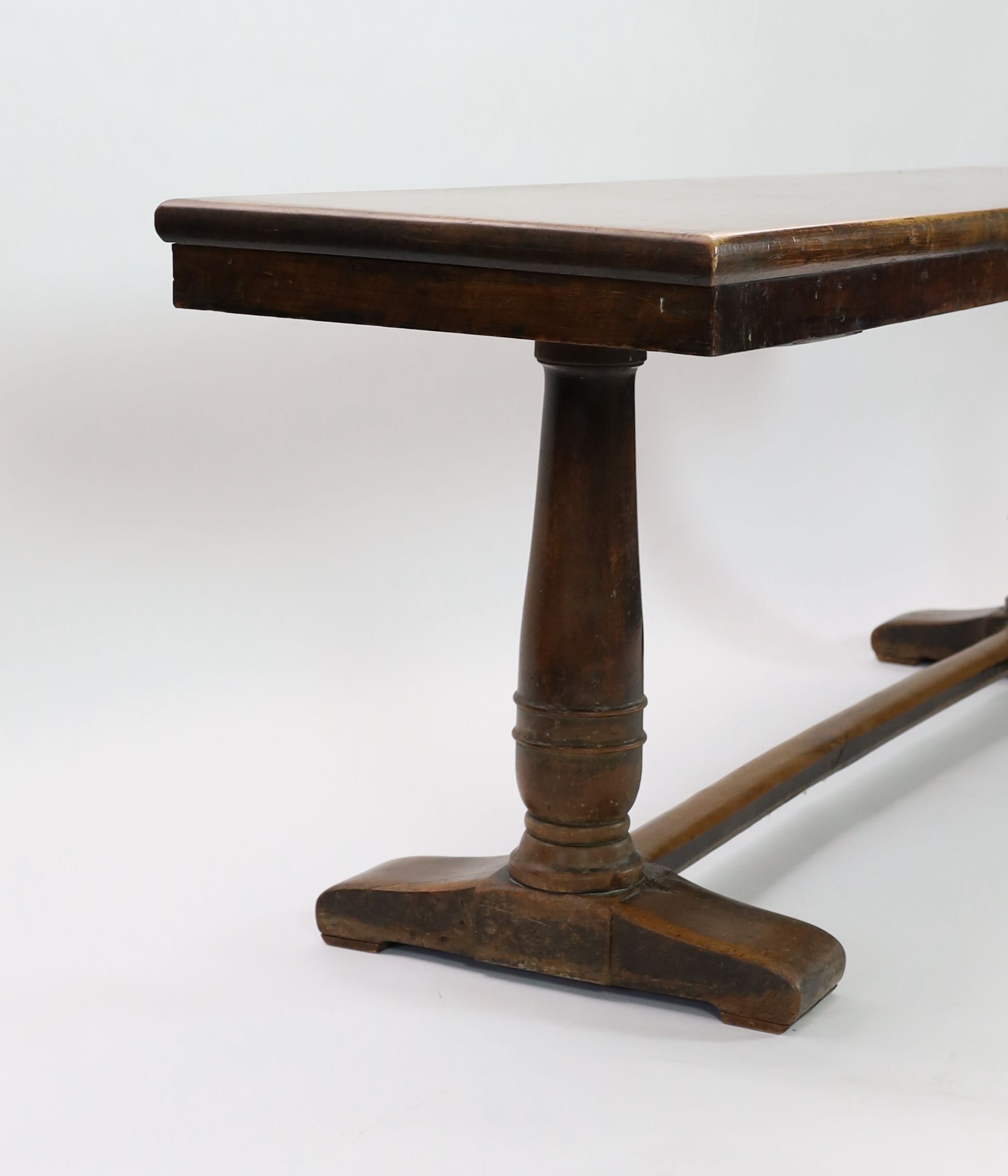 An 18th century walnut refectory table, W.232cm D.59cm H.82cm